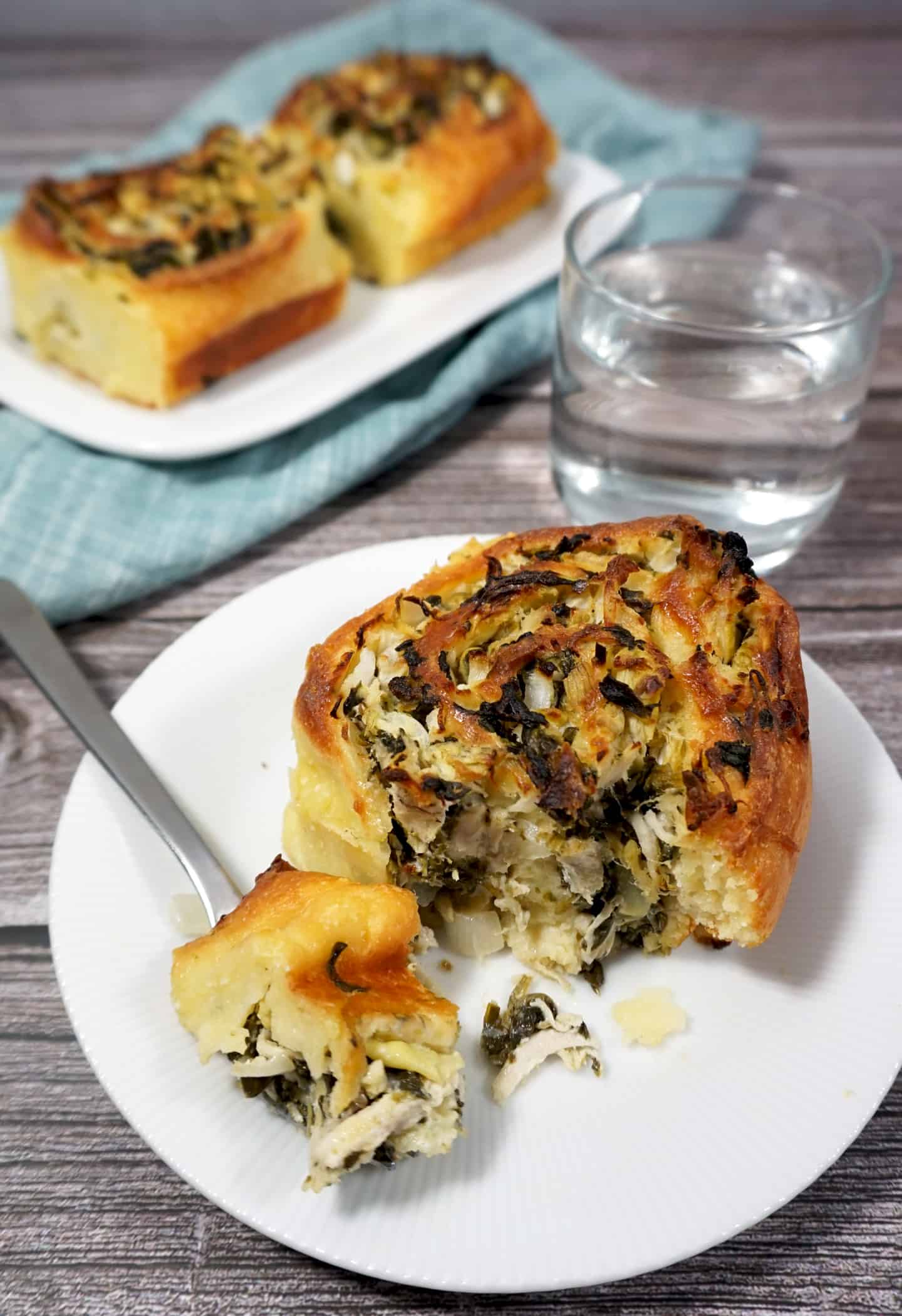 Plate with a spinach artichoke toaster oven roll