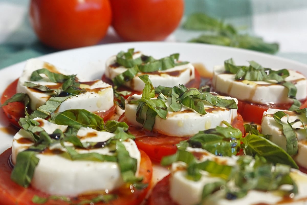 Caprese with balsamic glaze and olive oil sideview