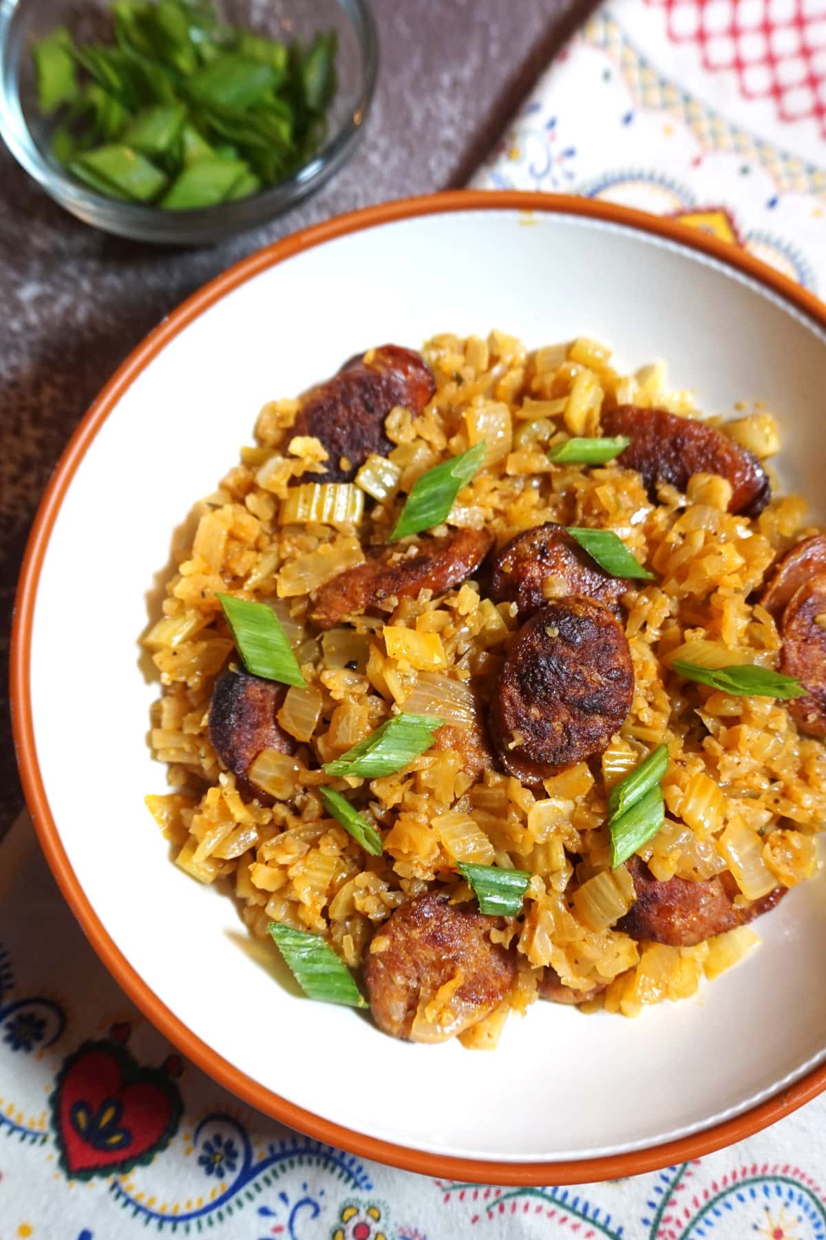 Bowl of Portuguese Sausage and Rice sprinkled with green onions
