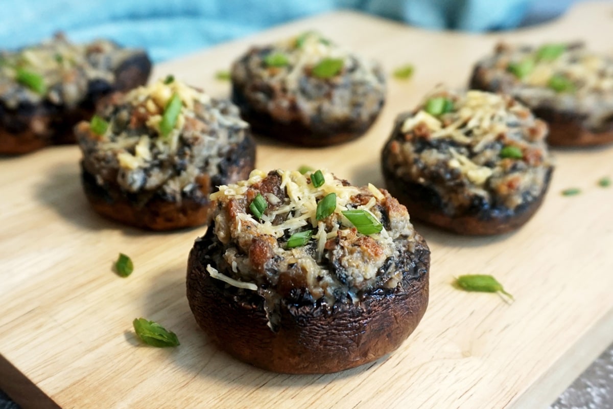 Stuffed mushrooms with bacon and garnished with green onions