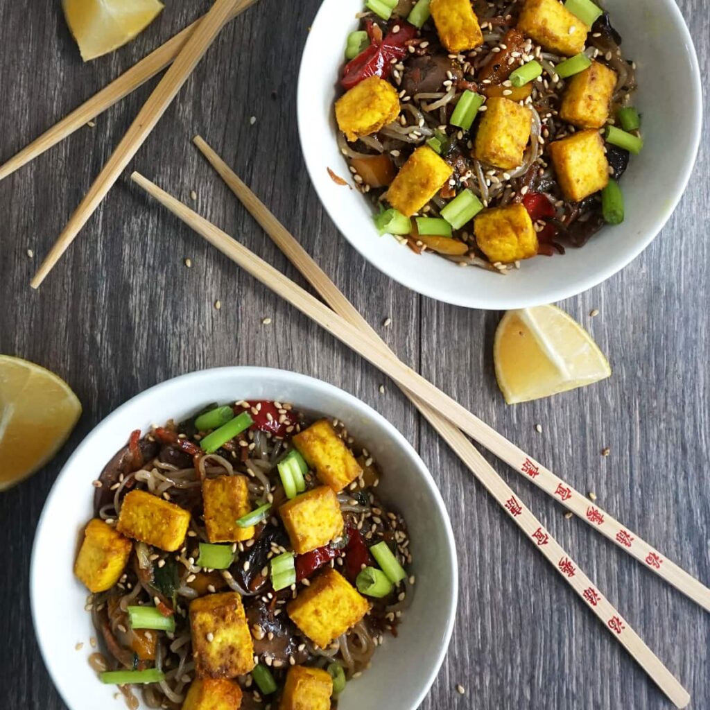 Two bowls of Vegan Noodle Stirfry with Turmeric Tofu