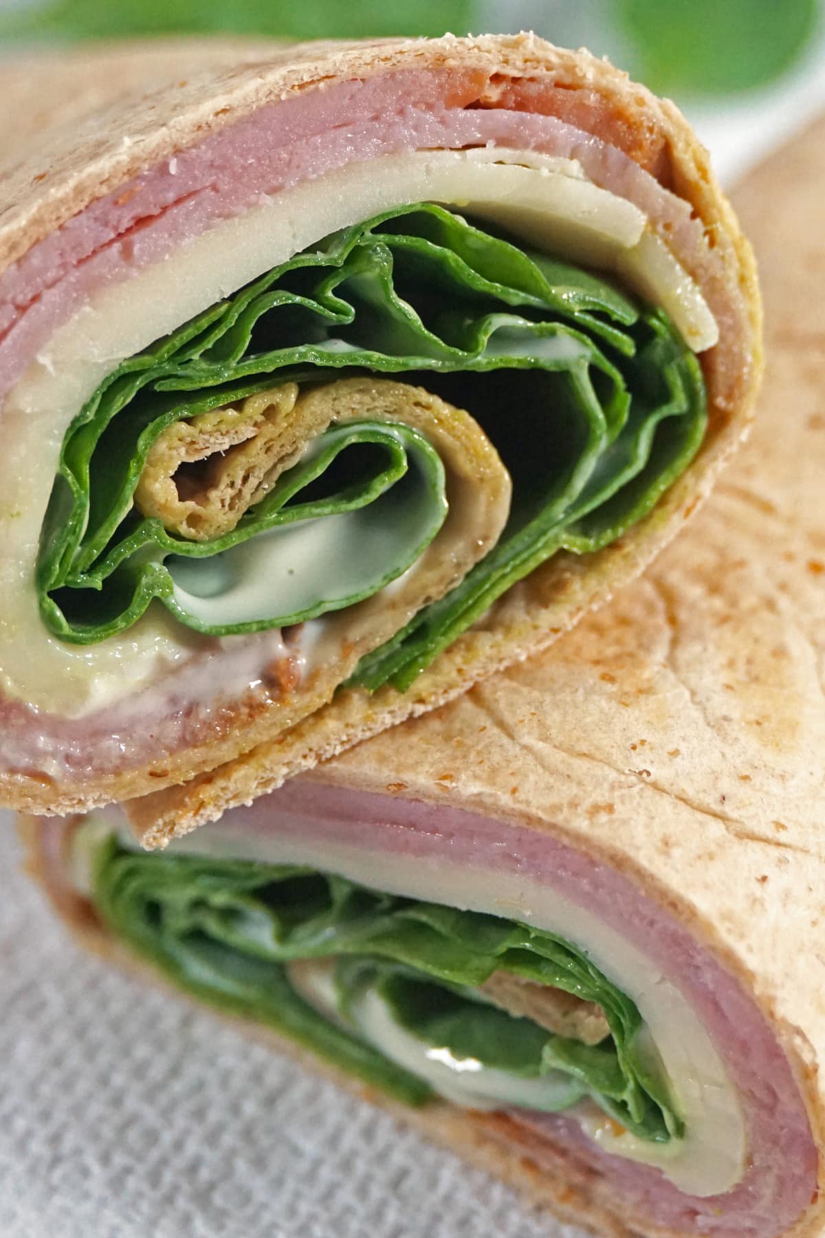 Closeup of a low carb wrap with ham and cheese