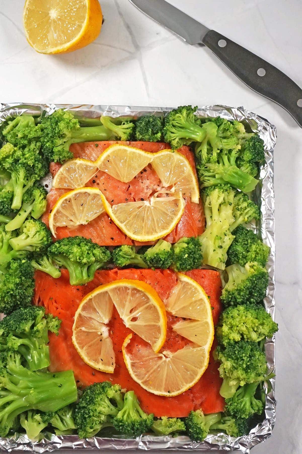 Salmon and broccoli with lemon on a toaster oven pan