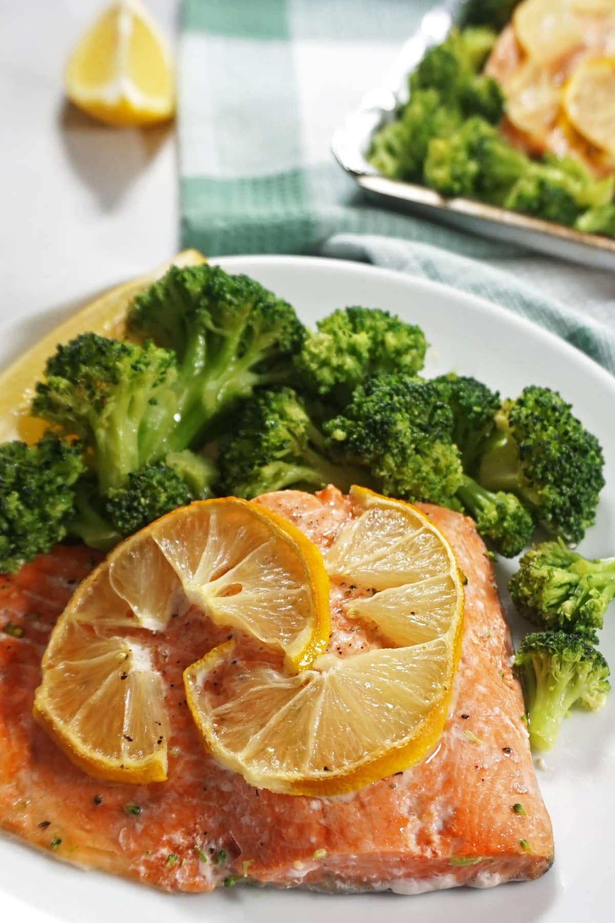 Salmon and broccoli with lemon on a plate