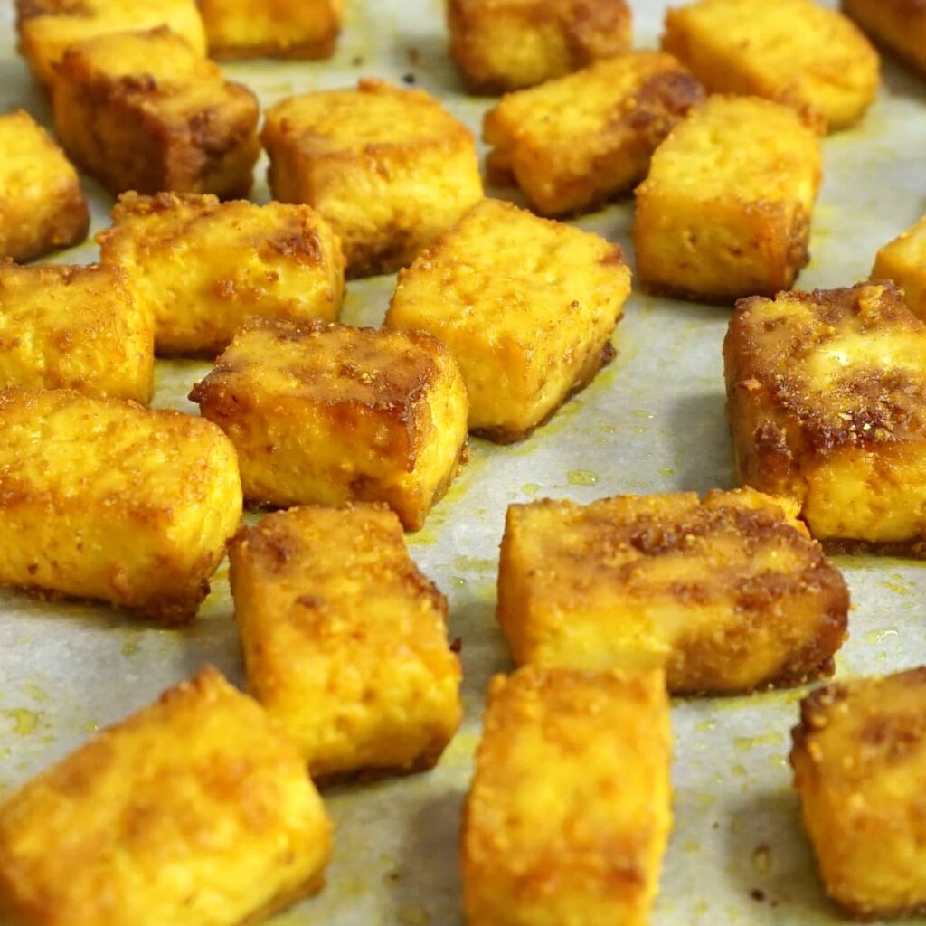 Baked turmeric tofu in a pan out of the oven
