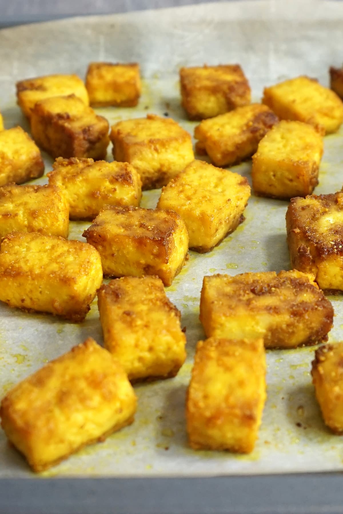 Baked turmeric tofu in a pan out of the oven