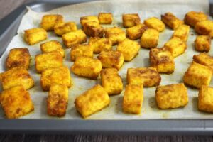 Baked turmeric tofu in a pan out of the oven