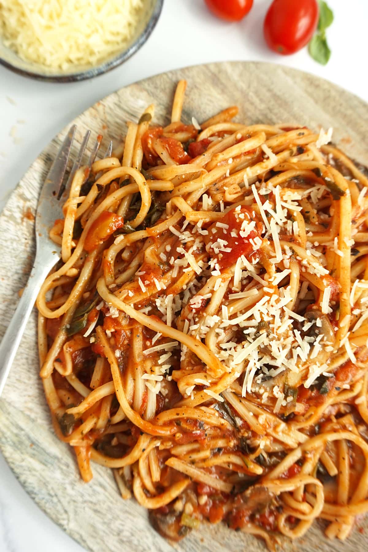 A plate of palmini spaghetti with a fork on the plate
