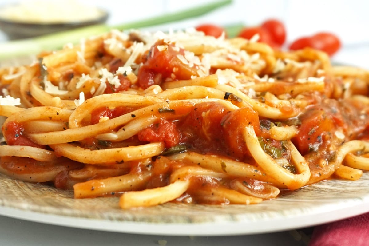 Closeup view of spaghetti and chunky sauce