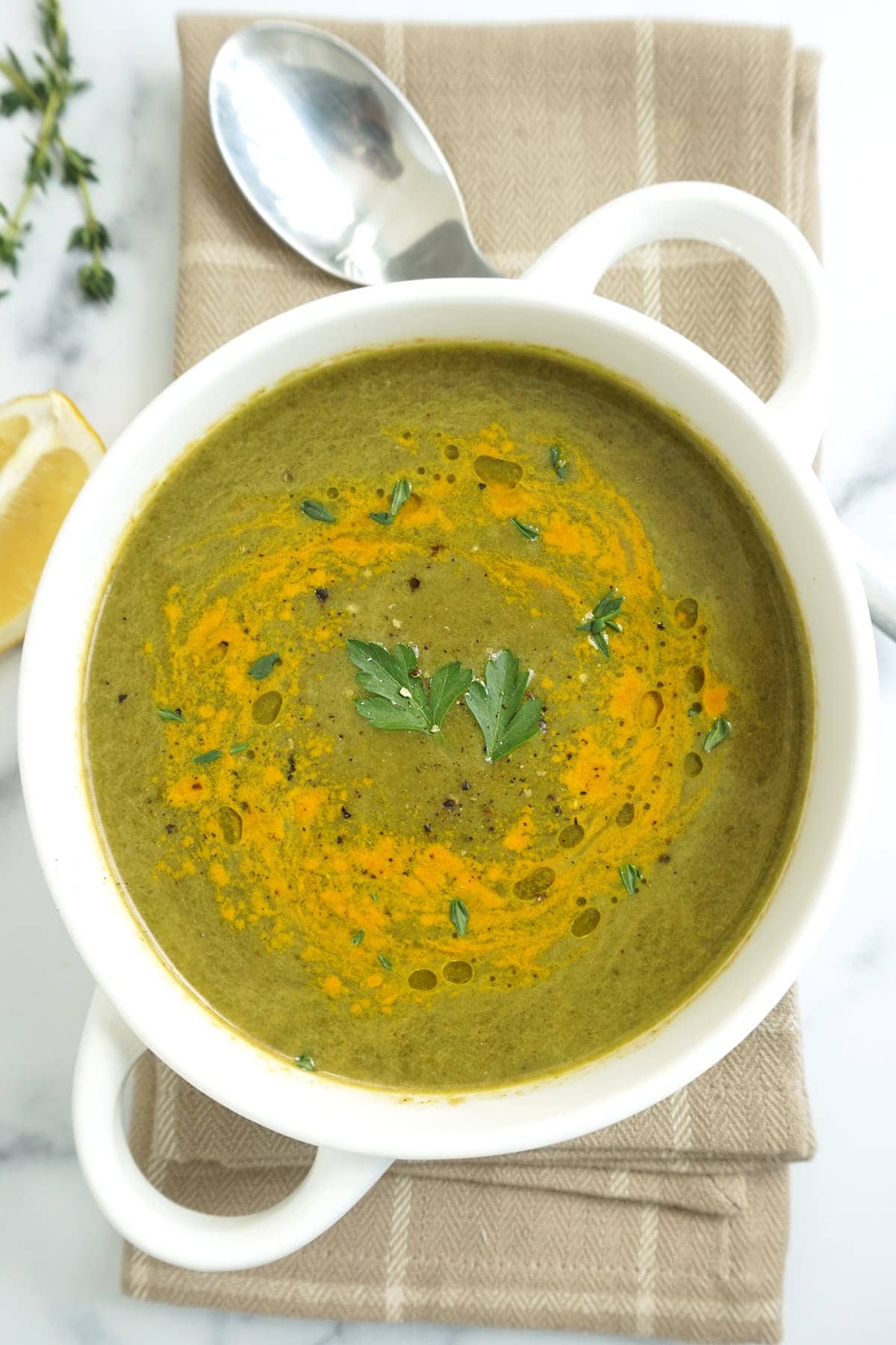 Bowl of soup with a spoon on the side