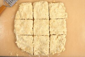 biscuit dough cut into nine squares