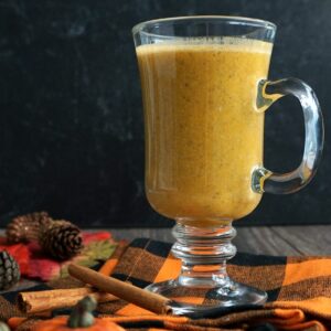Cup of Low-Carb Pumpkin Spice Smoothie on an orange napkin